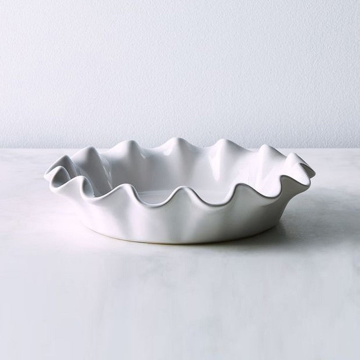 https://kitchenalamode.com/cdn/shop/files/emile-henry-french-ceramic-deep-ruffled-pie-dish-o_710x.jpg?v=1702052510
